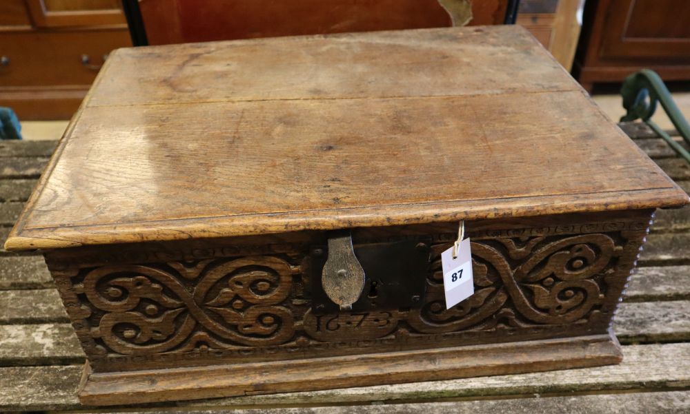 A 17th century carved oak bible box, width 63cm